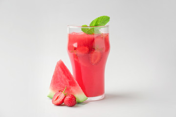 Glass of fresh watermelon juice on white background