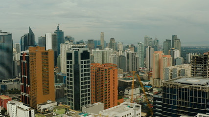 Cityscape of Makati, the business center of Manila. Asian metropolis with skyscrapers view from above. Travel vacation concept.