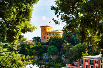 Obraz premium Portofino, Italy - AUGUST 15, 2019: Views of Portofino, a popular resort in Europe / urban architecture among trees / Italian Riviera