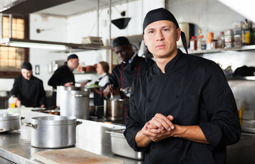 Professional male chef in kitchen of restaurant