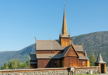 Fototapeta na wymiar Wooden church Lomskyrkja in Lom, Norway, one of the biggest stave churches in Norway. Church dates back to 1158-59.