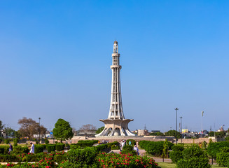 Minar-e-Pakistan, a national monument in Lahore, Pakistan on the blue sky background - obrazy, fototapety, plakaty