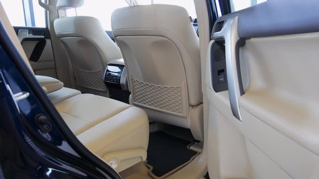 Car interior with luxury leather seats. SUV with leather upholstery, front seats and back seats