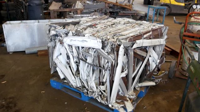 Tin and steel cans, aluminum, and sheet metal in a recycling plant