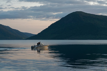 Fototapeta na wymiar Tourist boat in fjords, Rosendal, Norway