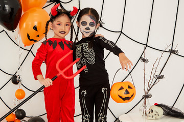 Asian child girls in halloween costumes