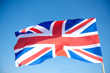 Close up of waving British flag in the sky