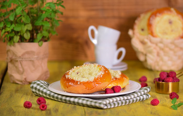 Fresh homemade open patties with cottage cheese. Traditional Russian pastry vatrushka, round buns with raspberries