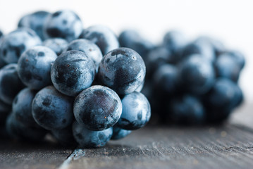 red grape on black wooden table