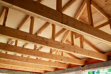 view of wooden rafters when installing roof on construction of house
