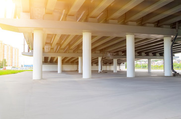 sunlight penetrates under the overpass