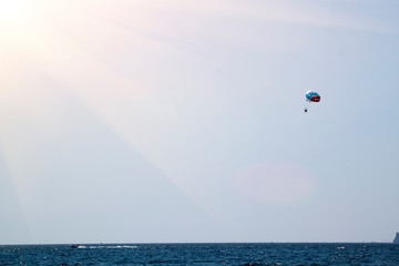 Parasailing - active form of recreation, in which a person is fixed with a long rope to a moving boat and thanks to presence of special parachute hovers through the air