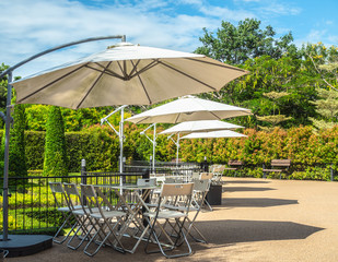 Garden umbrella outdoor with table and chairs in garden