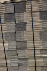 Stacks of folded cardboard boxes