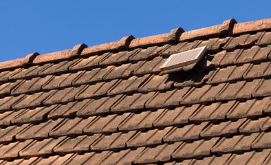 Naklejka premium Small solar panel on a large roof in Madagascar