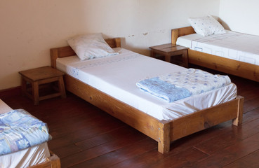 Old wooden bed (dormitory)