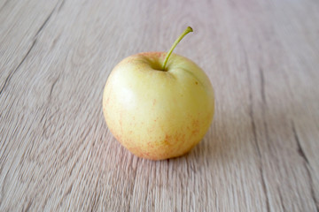 close up red apple isolated on wood background