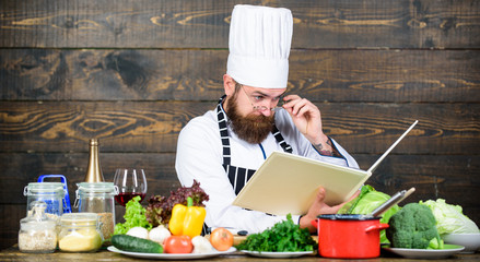 Cookery on my mind. Improve cooking skill. Book recipes. According to recipe. Man bearded chef...
