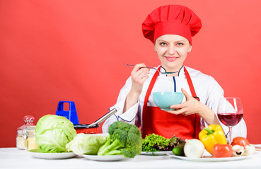 Housewife routine. Cooking healthy food. Cooking meal. Professional cooking tips. Woman chef try taste eat food. Delicious recipe concept. Girl at kitchen table. Cooking food and housekeeping