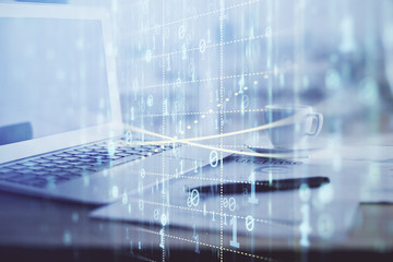 Double exposure of table with computer on background and data theme hologram. Data technology concept.