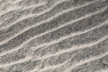 Striature chiare sulla sabbia scura - texture