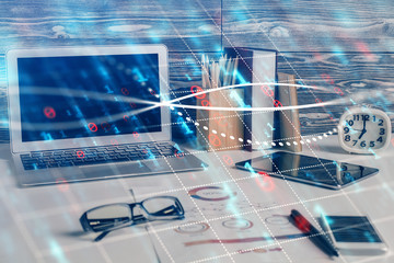 Double exposure of graph and financial info and work space with computer background. Concept of...