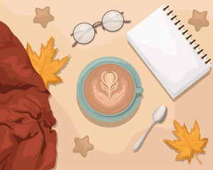 Autumn flat lay with the notebook, eyeglasses, wool scarf, coffee and autumn leaves.