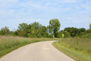 The curved road in the countryside on a sunny day.