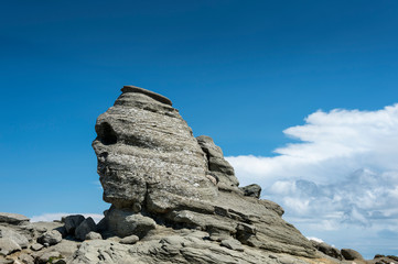 View of the rock known as the Sphinx (Sfinxul), near the town of Busteni, in the Carpathian Mountains (Bucegi), in Transylvania (Romania).