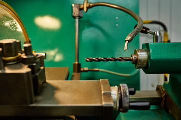 Drill in the chuck of a lathe. Metal processing technology. Close-up.
