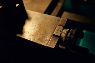 Control detail on a manual lathe. Metal processing in production.Close-up.