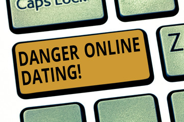 Word writing text Danger Online Dating. Business concept for The risk of meeting or dating demonstrating meet online Keyboard key Intention to create computer message pressing keypad idea