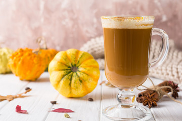 Pumpkins spice latte with pumpkins Copy space. Pumpkin latte - cozy drink for cold fall or winter