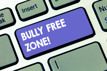Writing note showing Bully Free Zone. Business photo showcasing Be respectful to other bullying is not allowed here Keyboard key Intention to create computer message pressing keypad idea