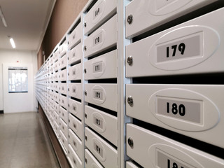 white mailboxes in apartment building
