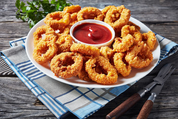 crispy calamari rings on a white plate