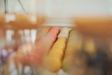 Picture of colorful macarons in pastry shop.