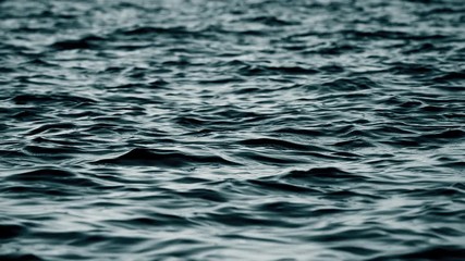 Black waves. Abstract black liquid. Slow motion.