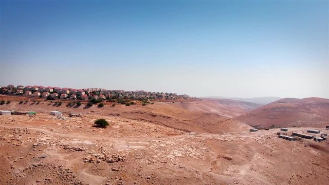 Bedouin Camp Close to Israeli City Maale Adumim Aerial Drone footage over Bedouin outpost Close to Israeli City Maale Adumim Aerial