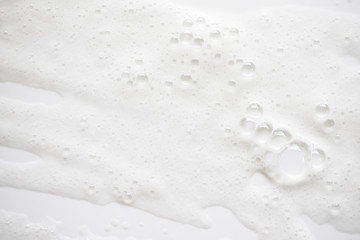 Abstract background white soapy foam texture. Shampoo foam with bubbles