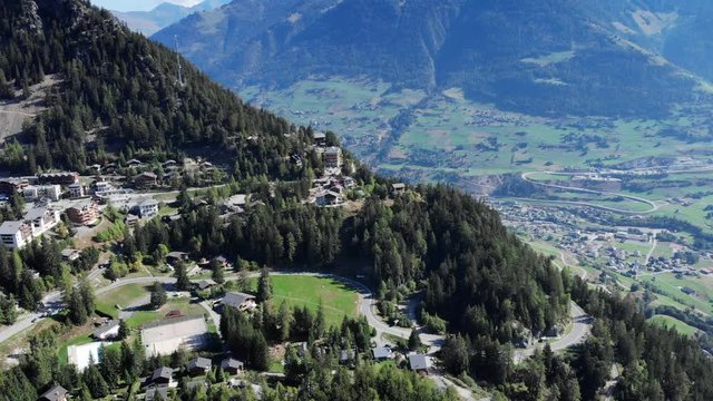 Champex-Lac with scenic view on the valley aerial shot. 4K Drone shot in the Swiss alps