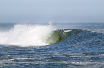 Large powerful barreling wave. 