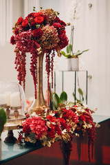 Wedding decor with vase and red flowers roses