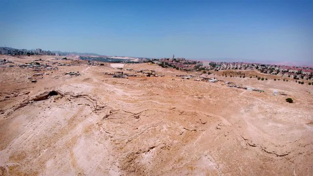 Bedouin Camp Close to Israeli City Maale Adumim Aerial Drone footage over Bedouin outpost Close to Israeli City Maale Adumim Aerial