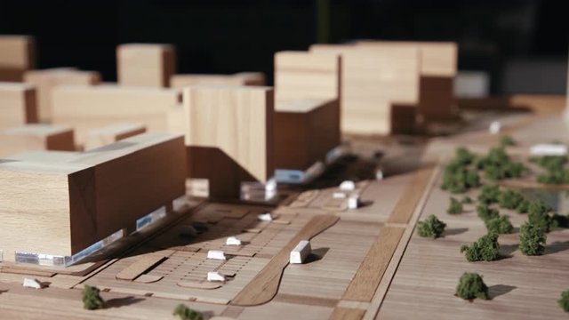 Miniature Residential Quarter with Detailed Planning from Wood Objects. The Concept of a Healthy Lifestyle for Residents in Town. Constructor in the Form of a Green Area With Shrubs, Pond and Parking