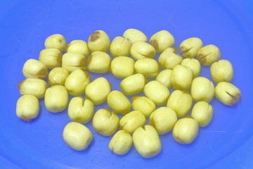 Roasted lotus seed on blue background 