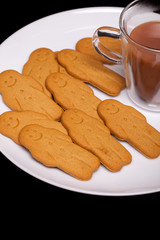 Homemade gingerbread men. Tea and ginger cookie biscuits comfort food.