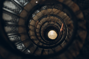 Spiral staircase and human hand