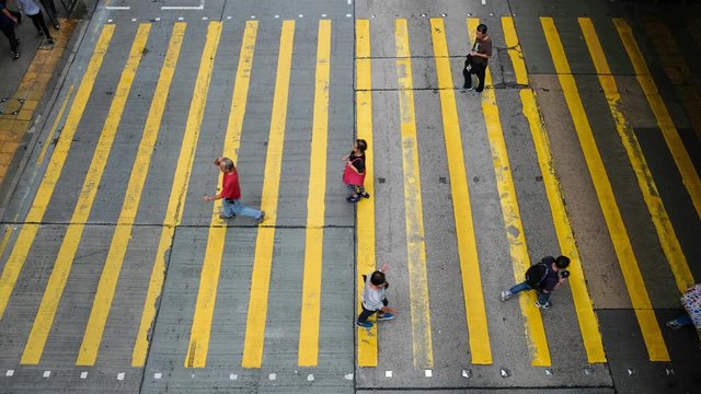 Busy pedestrian and car crossing at Hong Kong - time lapse	
