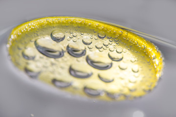 a slice of lemon with bubbles.  Fresh lemon slice in water with bubbles